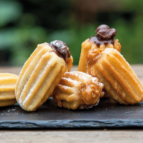 Disfruta del exquisito sabor de los Mini churros rellenos de manjar en la comodidad de tu hogar.